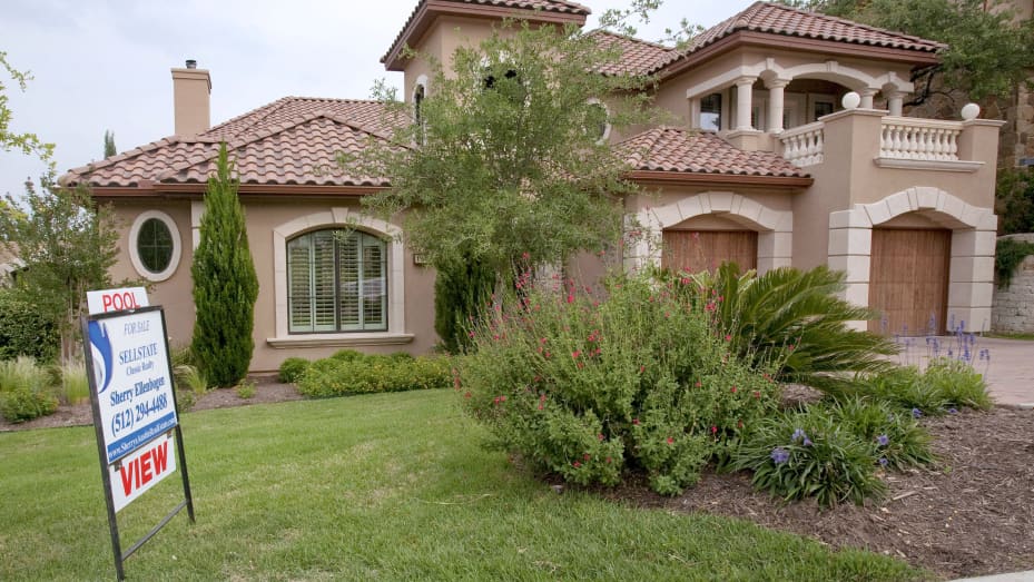 A sign stands outside an upscale home for sale in the Lake Pointe Subdivision of Austin, Texas, U.S.
