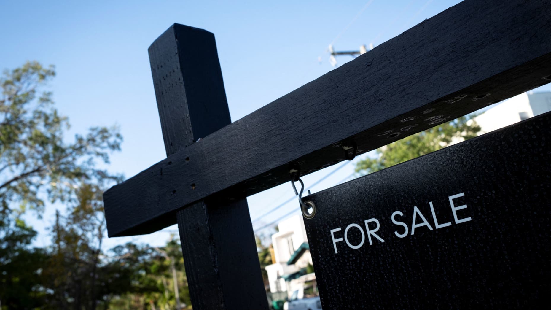 A "For Sale" sign stands at a house in Miami, Florida, U.S. April 16, 2025. REUTERS/Marco Bello