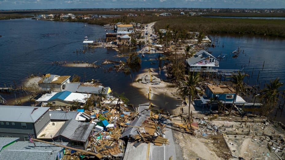 TOPSHOT - An aerial picture taken on October 1, 2022 shows a broken section of the Pine Island Road and destroyed houses in the aftermath of Hurricane Ian in Matlacha, Florida. - Shocked Florida communities counted their dead October 1, 2022, as the full scale of the devastation came into focus, two days after Hurricane Ian tore into the coastline as one of the most powerful storms ever to hit the United States. (Photo by Ricardo ARDUENGO / AFP) (Photo by RICARDO ARDUENGO/AFP via Getty Images)