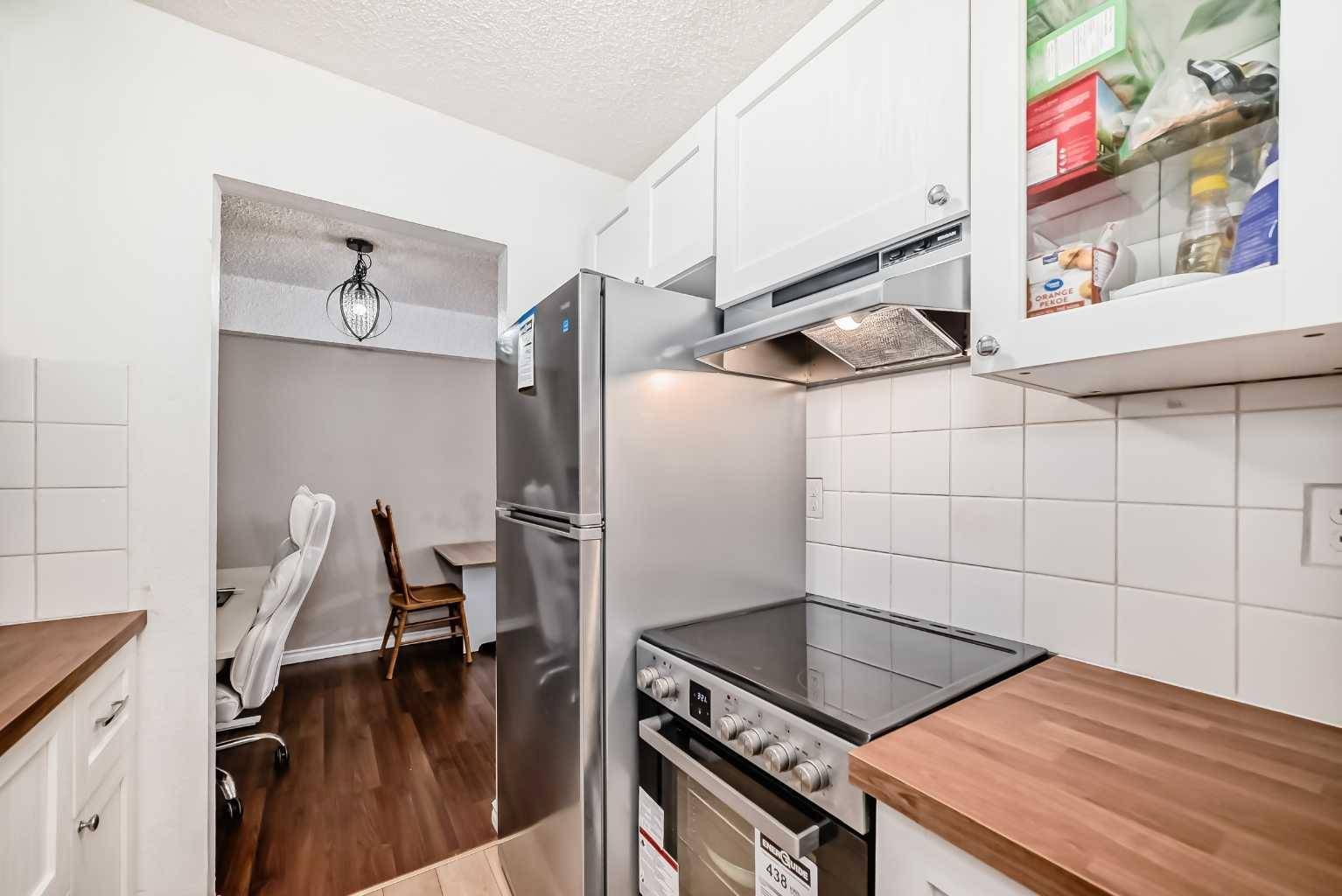 Calgary, AB T3C 1S5,1113 37 ST SW #203