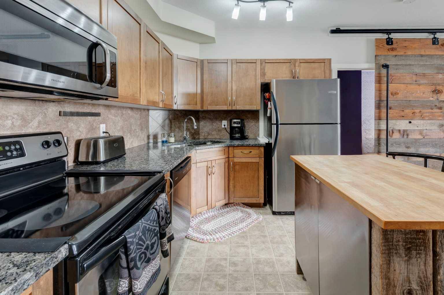 Airdrie, AB T4B 3H4,132 1 AVE NW #402