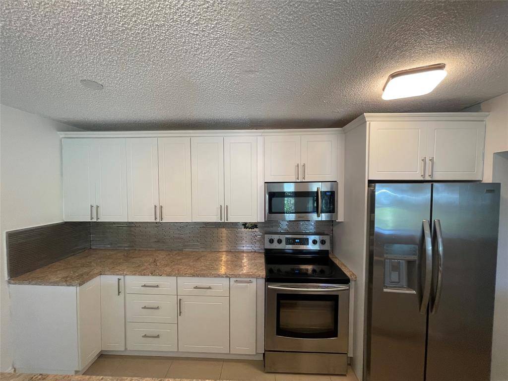 Tamarac, FL 33319,5190 E Sabal Palm Blvd #104