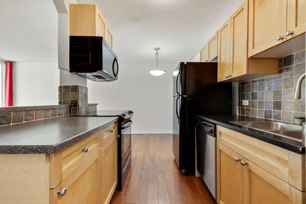 Calgary, AB T3C 0T3,1312 13 AVE SW #706