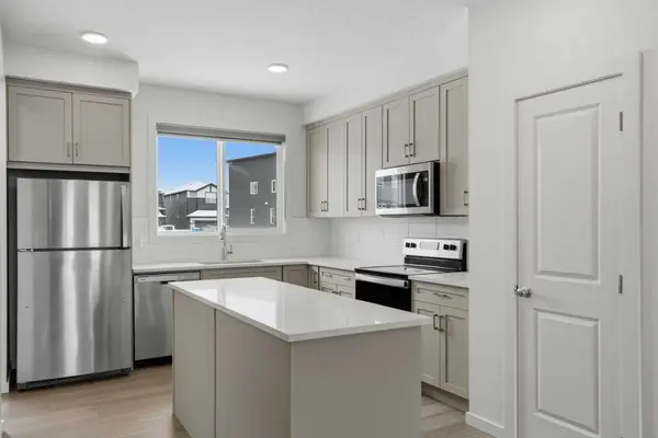 49 Belmont DR SW, Calgary, AB T2X 4Z6