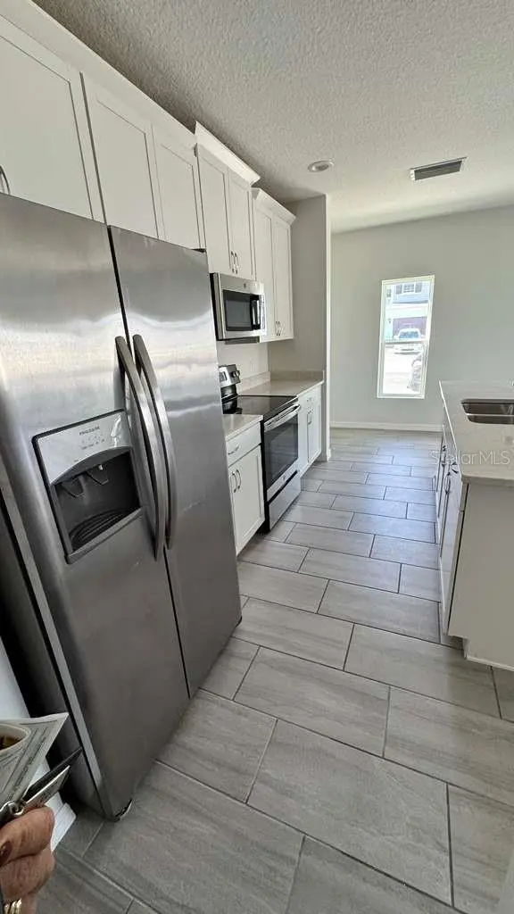 1298 WISPY CYPRESS DR, Kissimmee, FL 34746
