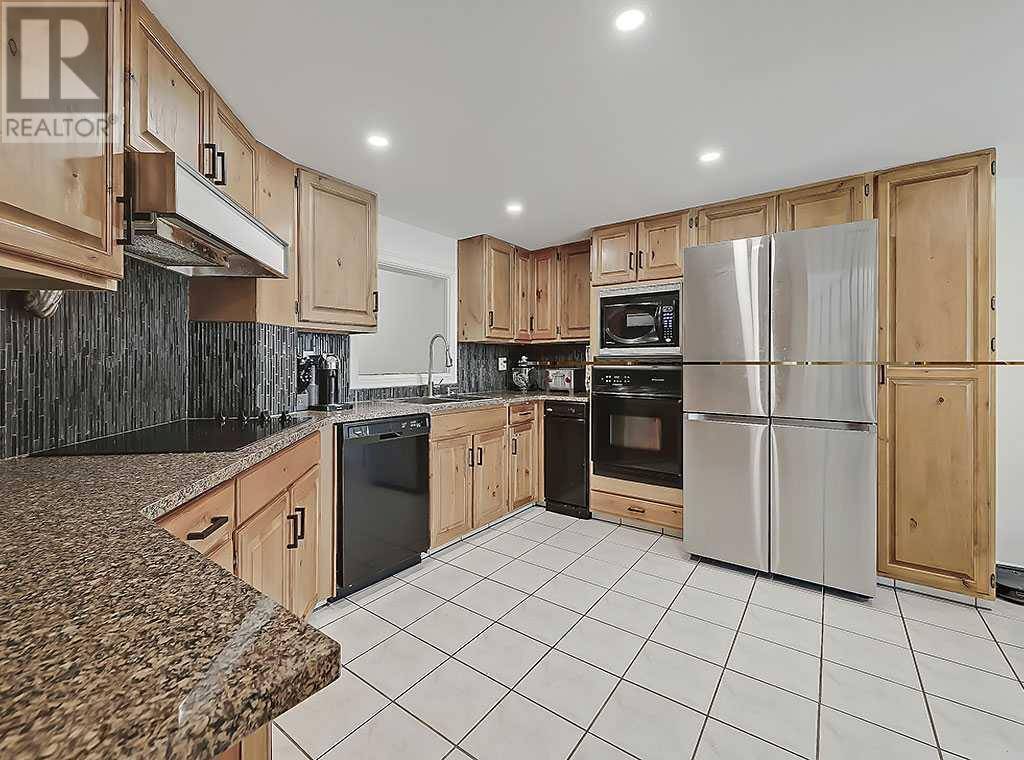 Calgary, AB T3H1M3,4, 448 Strathcona Drive SW