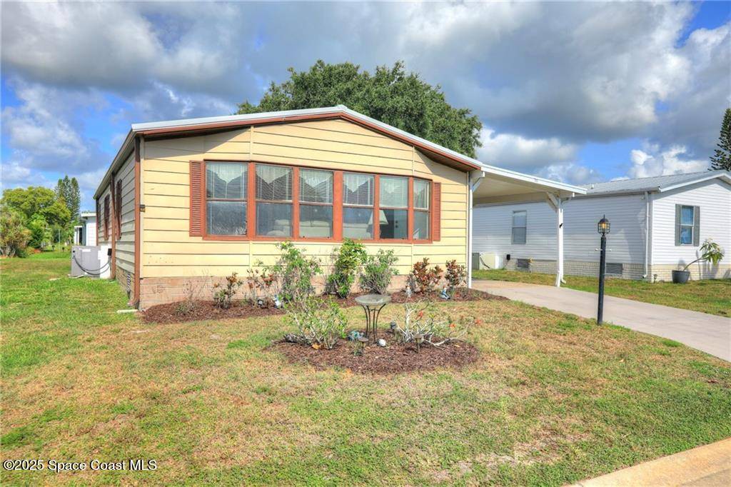 705 Hyacinth CIR, Barefoot Bay, FL 32976